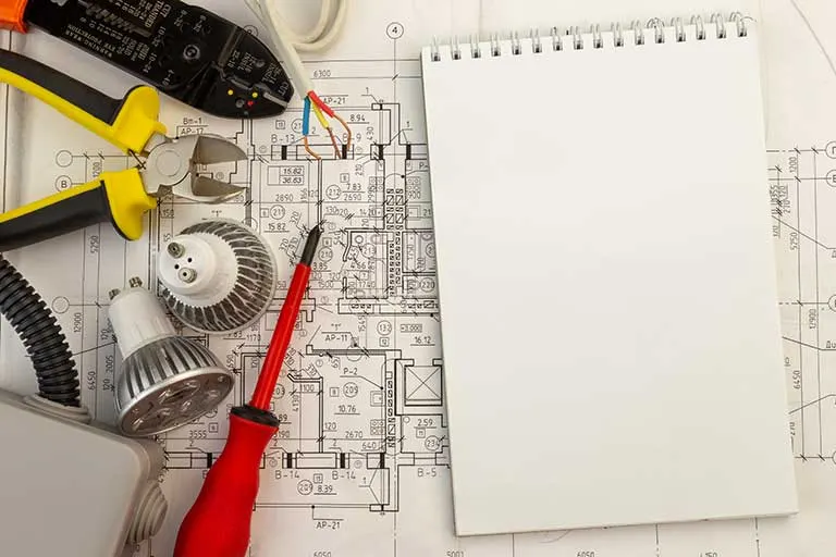 Electrical plans being reviewed by Ehman Electric before a new construction wiring job